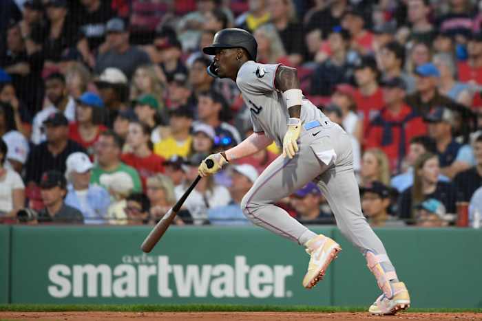 Miami Marlins center fielder Jazz Chisholm hits a single against the Boston Red Sox.